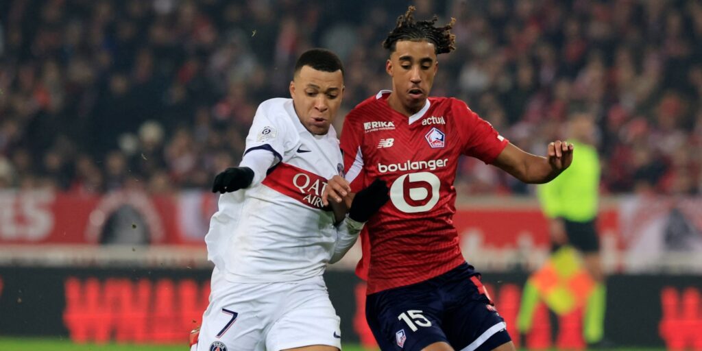 paris saint germain forward kylian mbappe in action with lille centre back leny yoro